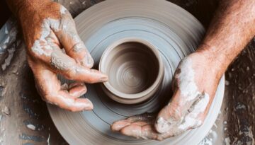 potters-hands-working-clay-on-a-potters-wheel-royalty-free-image-1652444634