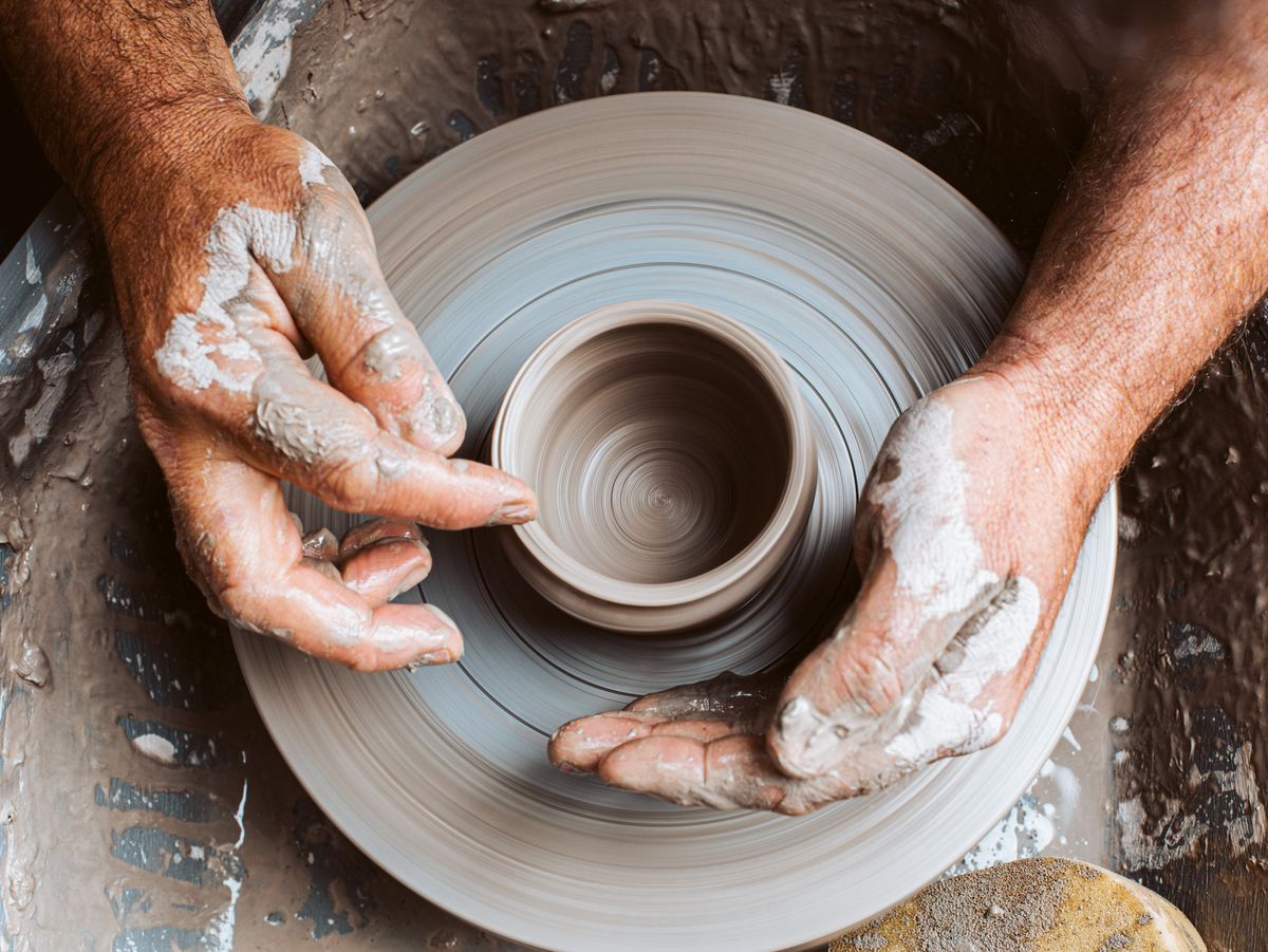 potters-hands-working-clay-on-a-potters-wheel-royalty-free-image-1652444634