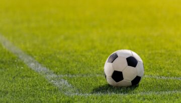 stock-photo-soccer-ball-on-grass