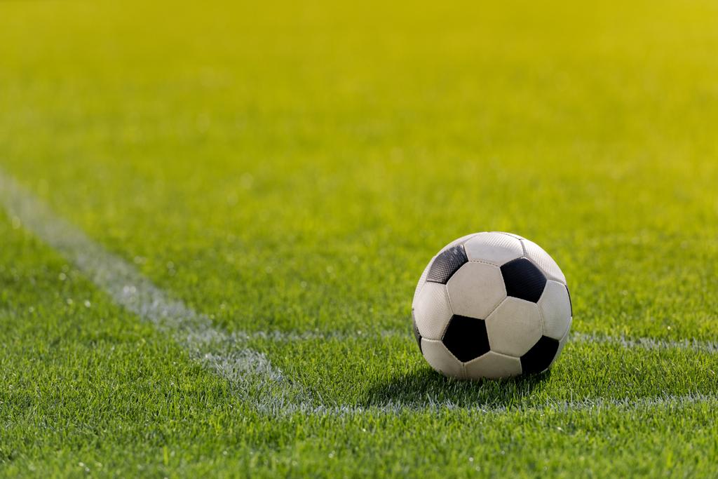 stock-photo-soccer-ball-on-grass